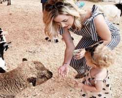 She is an animal lover and enjoys feeding them and also teaches her daughters to feed the animals.